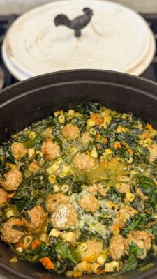 Family Savvy's Italian Wedding Soup sitting in a pot on the stove