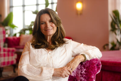 Becca Stevens, founder and president of Thistle Farms, sitting on a couch