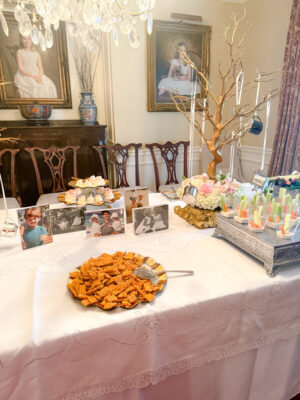 Baby Shower decor with serving platters and photos