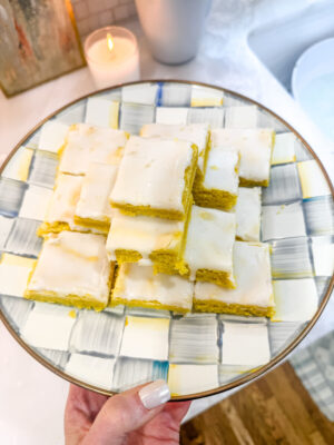 Bright yellow lemon brownies topped with a white lemon glaze