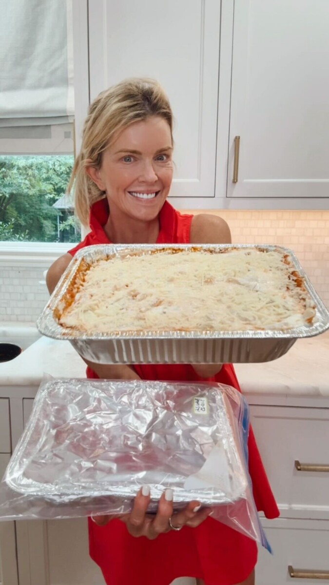 Jamie Tarence of Family Savvy holding a dish of her Baked Ziti recipe