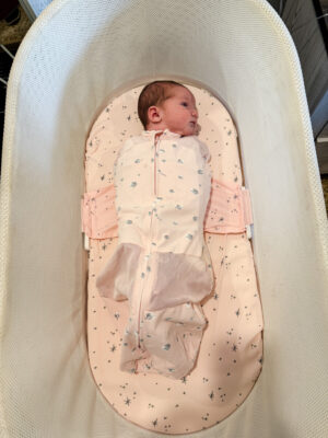 Jamie Tarence's baby granddaughter Anne Parker swaddled in the SNOO Smart Sleeper from Happiest Baby