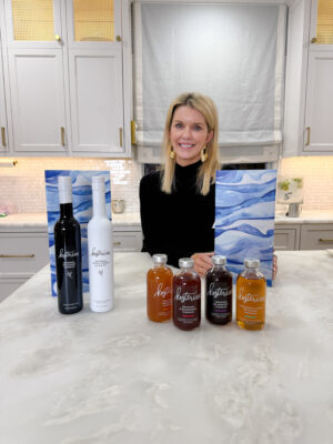 Jamie Tarence of Family Savvy with two Kosterina gift sets--the Dipping Duo set and the Holiday Cheers set.