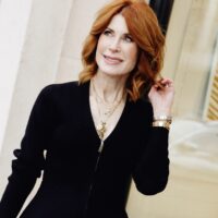 Cathy Williamson, a triple negative breast cancer survivor, walking down the street