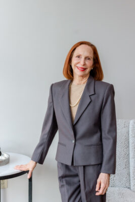 Headshot of dermatologist Dr. Joe Lynne Herzog, who is experienced in Botox, facial fillers, and skincare