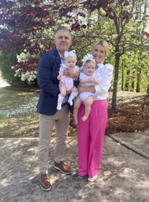 Jamie and Zane Tarence holding their grandbabies, Anne Parker and Mary Owen
