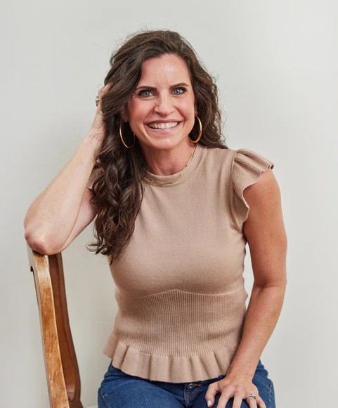 Meredith Mann, founder of The Peachie Spoon, wearing a tan shirt and smiling for the camera.
