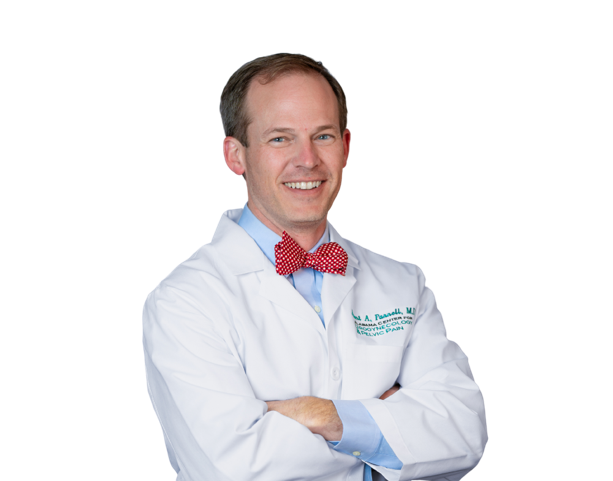 A photo of Dr. Parnell in his lab coat with arms crossed.